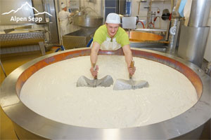 The dairyman Christoph at cheese making